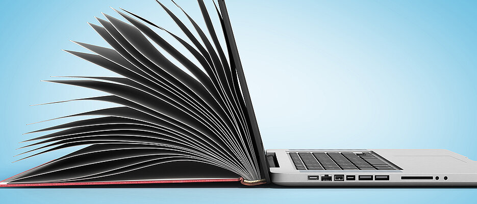 Symbilbild: Buch und Laptop 