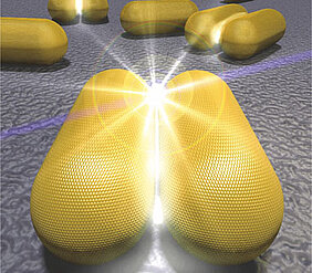 Künstlerische Darstellung zweier Goldnanostäbchen mit einem stark lokalisierten Lichtfeld im atomar-kleinen Luftspalt.(Grafik Thorsten Feichtner)