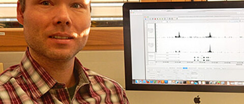 Dr. Elmar Wolf at his desk in the University of Würzburg's Biocenter.