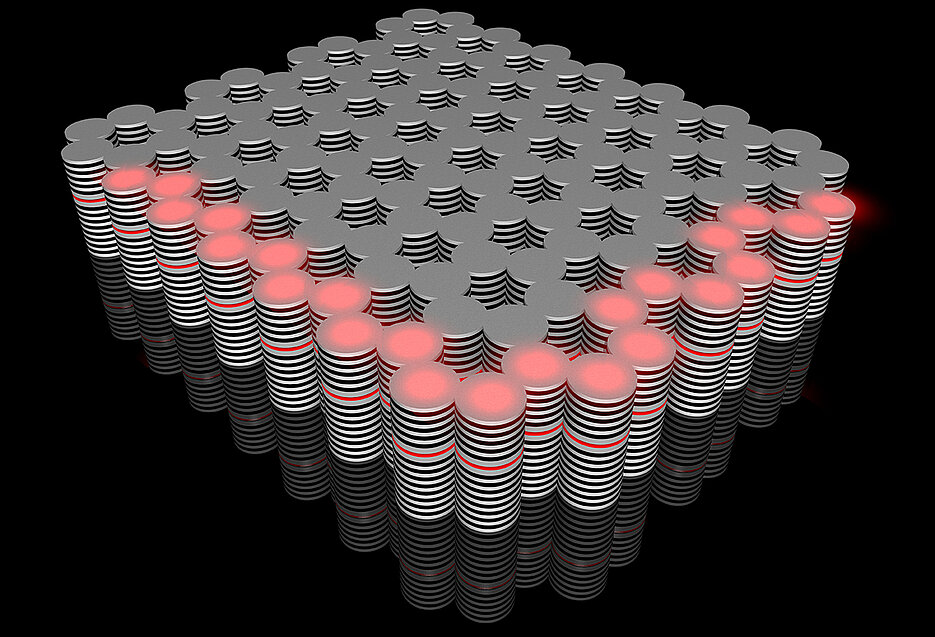 The novel topological insulator built in the Würzburg Institute of Physics: a controllable flow of hybrid optoelectronic particles (red) travels along its edges. (Picture: Karol Winkler)