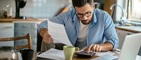 Photo of a man going through his financials problems