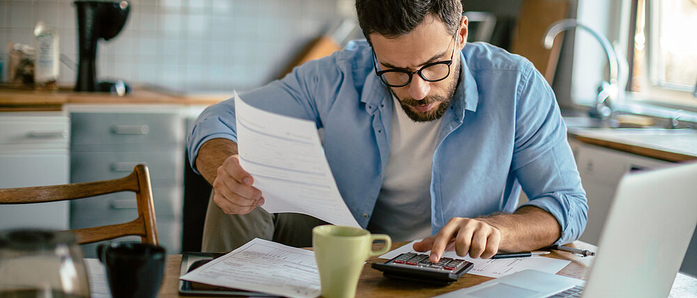 Photo of a man going through his financials problems