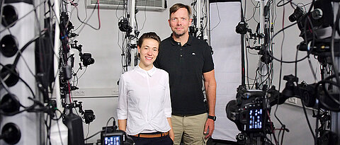 Marc Erich Latoschik and Carolin Wienrich in the lab where 120 cameras take multiple shots of a person to create an authentic avatar.