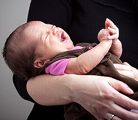 The crying of neonates exhibits characteristic melodic patterns influenced typically by their mothers' language.