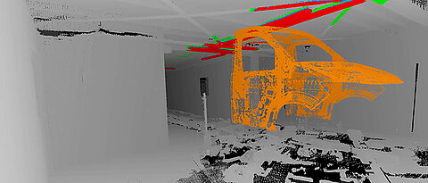 Section of an automotive production line and a simulated model as a 3D cloud of dots. The places where collisions would occur after a change of model are highlighted in red. (Picture: Andreas Nüchter)