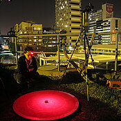 Claudia Tocco on the same night performing the same experiment at a light-polluted site: the roof of the University of the Witwatersrand in central Johannesburg.