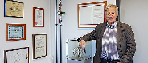 Professor Laurens Molenkamp with some of the numerous award certificates he has received over the past years. (Photo: Jasper Molenkamp)