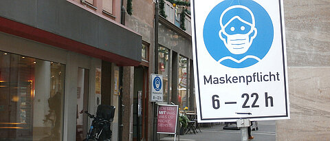 Some people might avoid this alley in Würzburg. The mere sight of a mask can activate fears of Covid. 