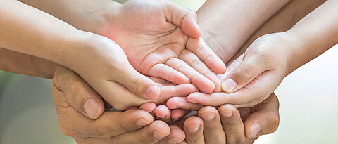 Family hands praying together (clipping path) for donation charity concept
